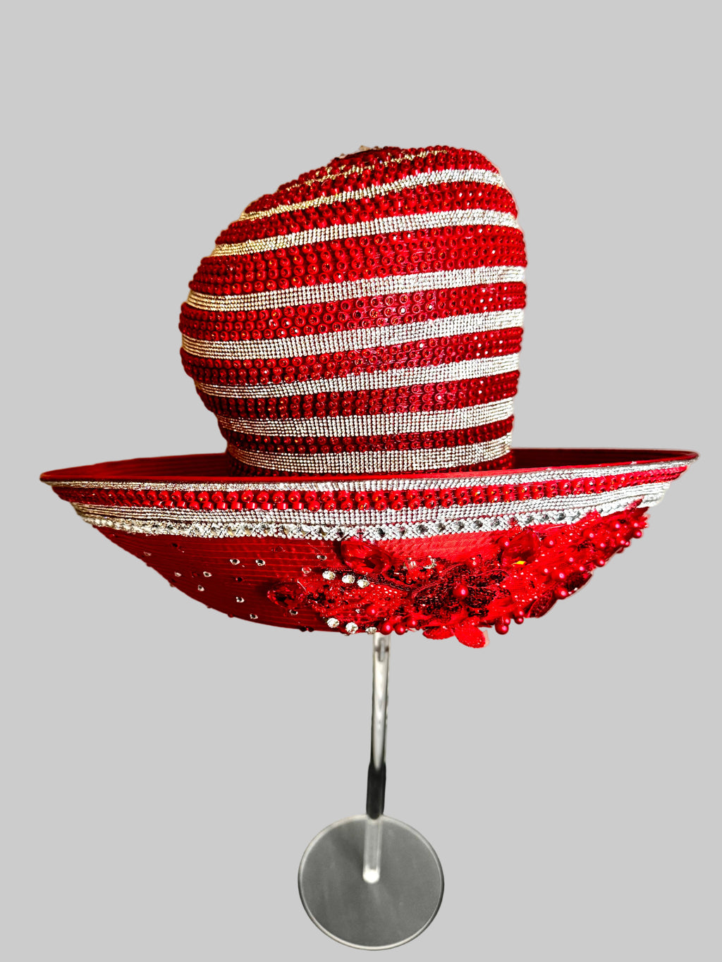 Red embellished church hat with flexible brim to showcase candy cane jewel in the